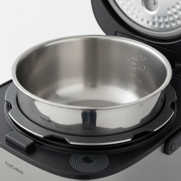 Inside view of a Cuchen IH rice cooker showcasing its 304 stainless steel inner pot