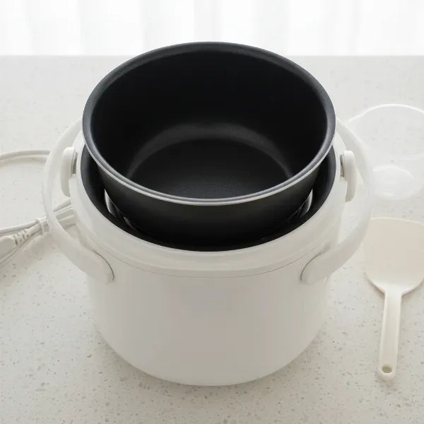 Nonstick inner pot and stay-cool handles of the Zojirushi NHS-06 for easy cleaning and safe handling.